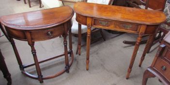 A 20th century walnut side table with a frieze drawer and reeded legs together with a D shaped side