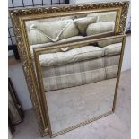 A rectangular gilt wall mirror together with two other wall mirrors, prints,