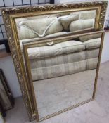 A rectangular gilt wall mirror together with two other wall mirrors, prints,