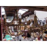 A pair of gilt metal eight branch chandeliers with matching wall lights