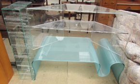 A frosted glass shaped coffee table together with a pair of Green Apple glass CD stands and a clear