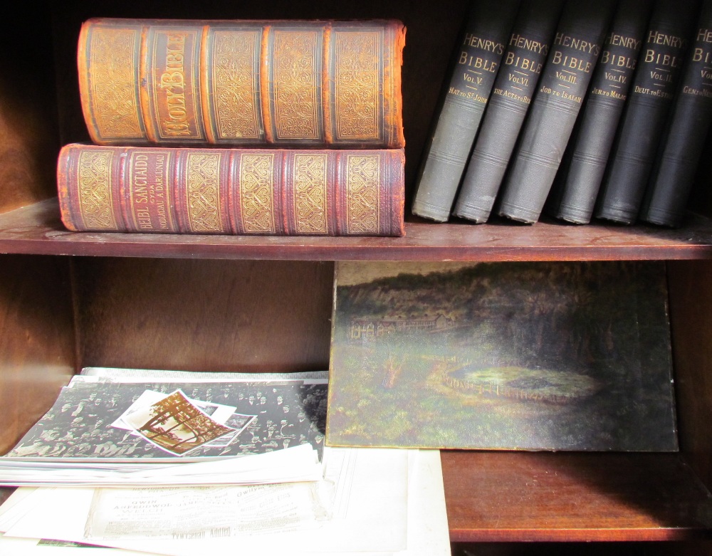 Six volumes of Henry's Bible together with two leather bound bibles, black and white photographs,