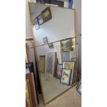 A large mahogany framed wall mirror together with a large brass framed wall mirror,