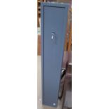 A grey metal gun safe