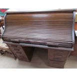 "The Lebus Desk" with a serpentine tambour front enclosing a fitted interior of pigeonholes and
