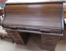 "The Lebus Desk" with a serpentine tambour front enclosing a fitted interior of pigeonholes and