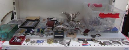A Rolex box together with replica medals, cap badges, costume jewellery, coins,