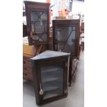 A 19th century oak hanging corner cupboard,