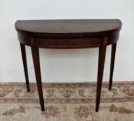 A 19th century mahogany card table,