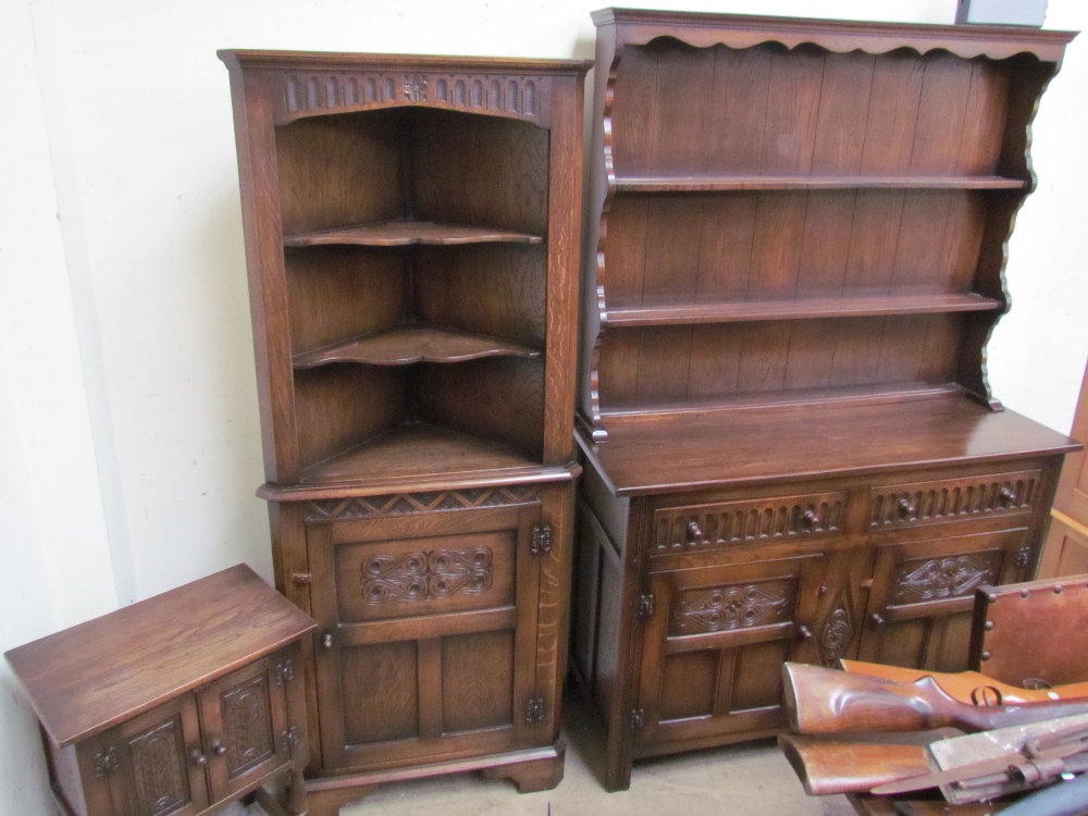 A Bevan Funnel oak dresser with a moulded cornice above two shelves and a planked back,