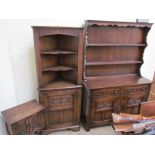 A Bevan Funnel oak dresser with a moulded cornice above two shelves and a planked back,