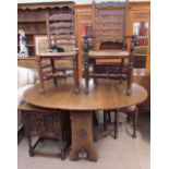 A 20th century oak gateleg dining table together with a set of four ladder back dining chairs and