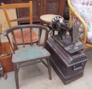 Two childs chairs together with a singer sewing machine and a stool