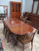 A Regency style mahogany extending dining table together with six chairs and a yew wall unit