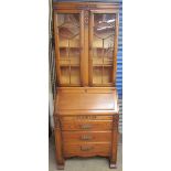 A 20th century oak bureau bookcase,