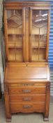 A 20th century oak bureau bookcase,