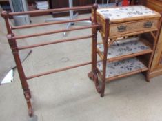 A bamboo side table, the rectangular top above a single drawer and two shelves,