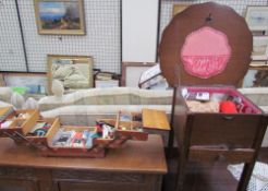 An oak sewing box of shaped circular form together with a concertina action sewing box