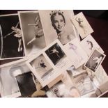 A collection of postcards and photographs,some signed, including ballet dancers, Gene Kelly,
