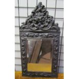 A stamped copper mirror together with an oil painting and prints