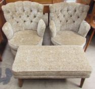 A pair of upholstered tub chairs together with an upholstered foot stool