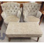 A pair of upholstered tub chairs together with an upholstered foot stool