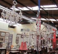 A pair of glass eight branch lustre drop chandeliers