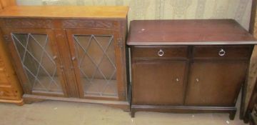 A 20th century oak bookcase together with a stag side cabinet