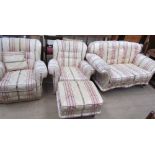 An upholstered four piece suite comprising a two seater settee,