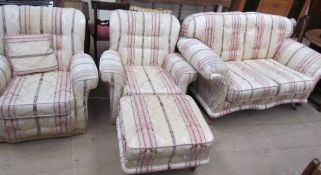 An upholstered four piece suite comprising a two seater settee,