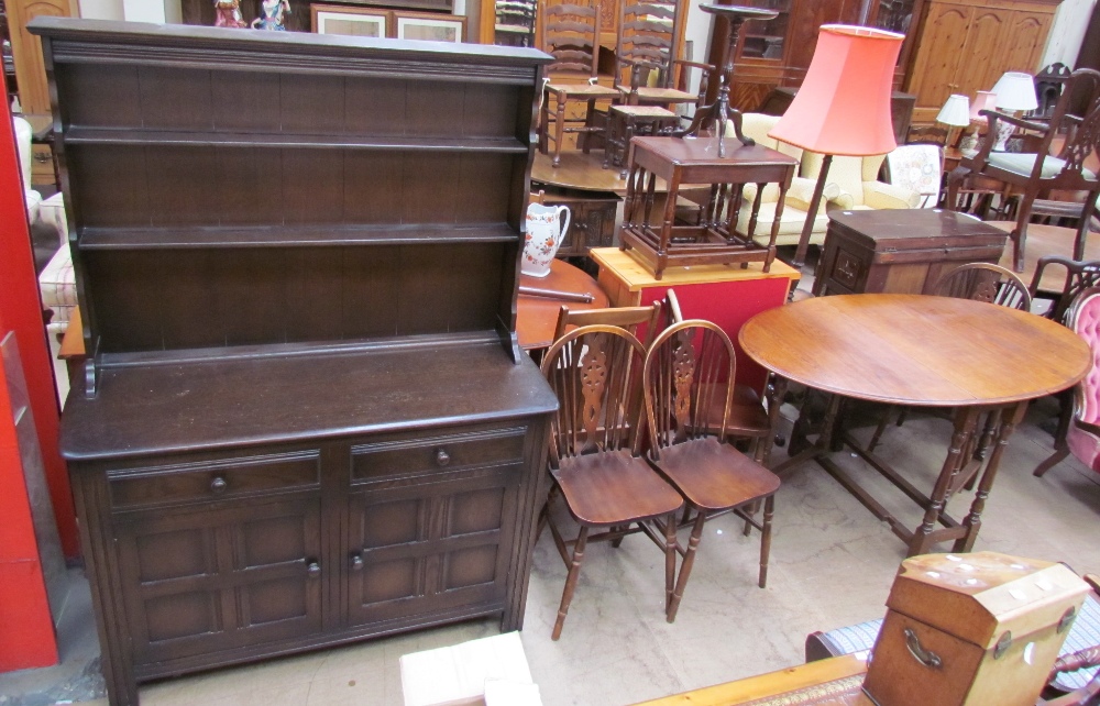 A 20th century oak dresser together with an oak gateleg dining table and four wheel back chairs