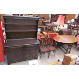 A 20th century oak dresser together with an oak gateleg dining table and four wheel back chairs