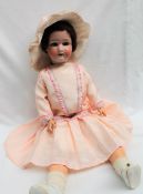 A Heubach Koppelsdorf bisque head doll, with closing blue eyes, open mouth and teeth,