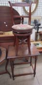 An Edwardian piano stool with a back and adjustable seat together with an oak occasional table with