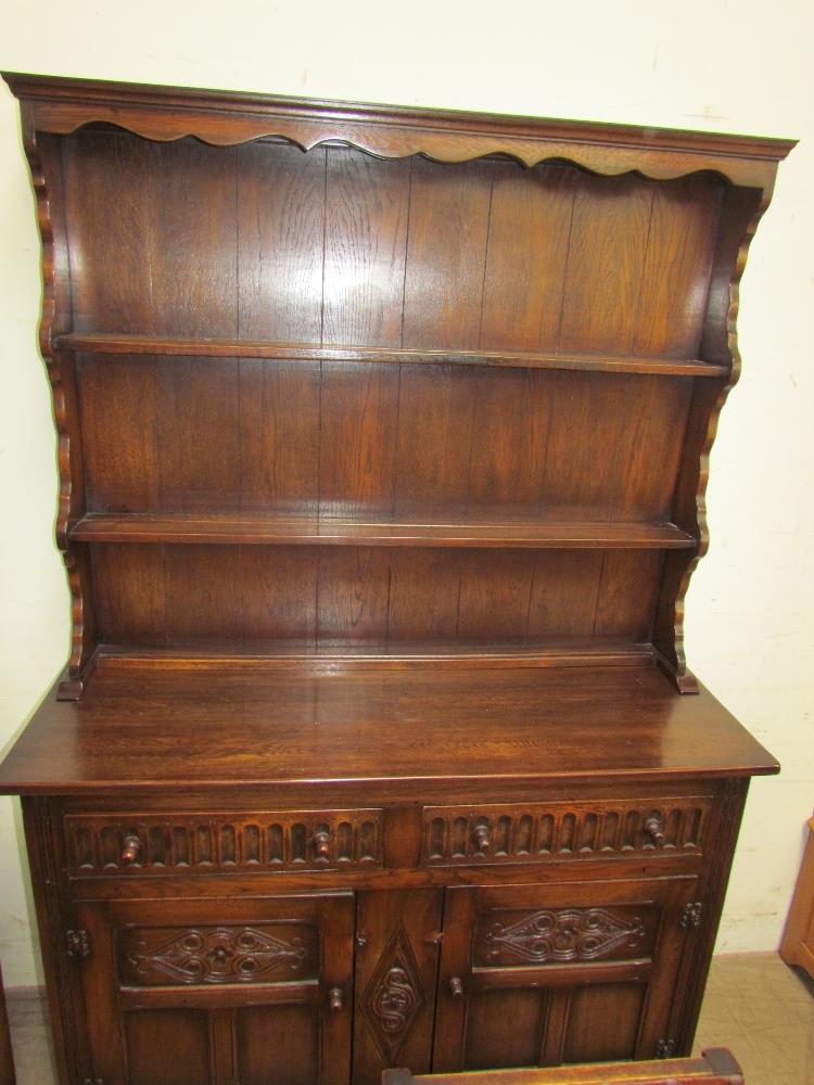 A Bevan Funnel oak dresser with a moulded cornice above two shelves and a planked back, - Image 4 of 4