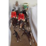 Two Beswick huntsmen in pink jackets on bay horses together with Beswick foals,