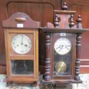 A Gustave Becker wall clock with an enamel dial and Roman Numerals together with an oak wall clock