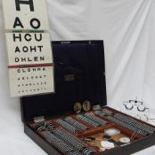 A Theodore Hamblin optometry set, with various lenses, contained in a case,