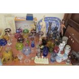 Assorted multicoloured wine glasses together with assorted gladiatorial figures, pottery figures,