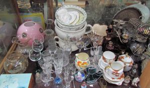 A large lot including drinking glasses, chamber pots and pink glass lamp shade,