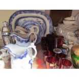 Assorted drinking glasses together with a part dinner set, blue and white plates,