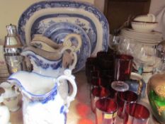 Assorted drinking glasses together with a part dinner set, blue and white plates,