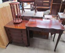 A reproduction mahogany chest of drawers together with a mahogany card table and plant stand