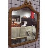A gilt wall mirror together with an alphabet print and a photograph