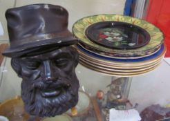 A tobacco jar in the form of a bearded man together with assorted plates