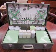 A Brexton picnic basket, with pottery plates, cups and saucers, with Tupperware boxes,