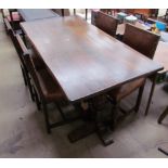 A 20th century oak refectory table and four leather dining chairs