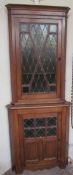 A 19th century oak standing corner cupboard,