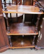 A Victorian walnut three tier whatnot,