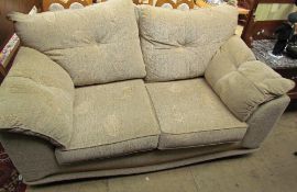 An upholstered two seater sofa